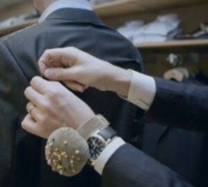 Mainline Custom Clothiers Custom - Tailor completing a fitting.