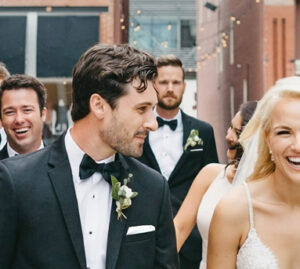 Mainline Custom Clothiers Weddings - Wedding scene, bride and groom with groomsmen.